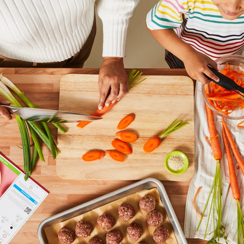 Mom and son cook HelloFresh homemade meal together