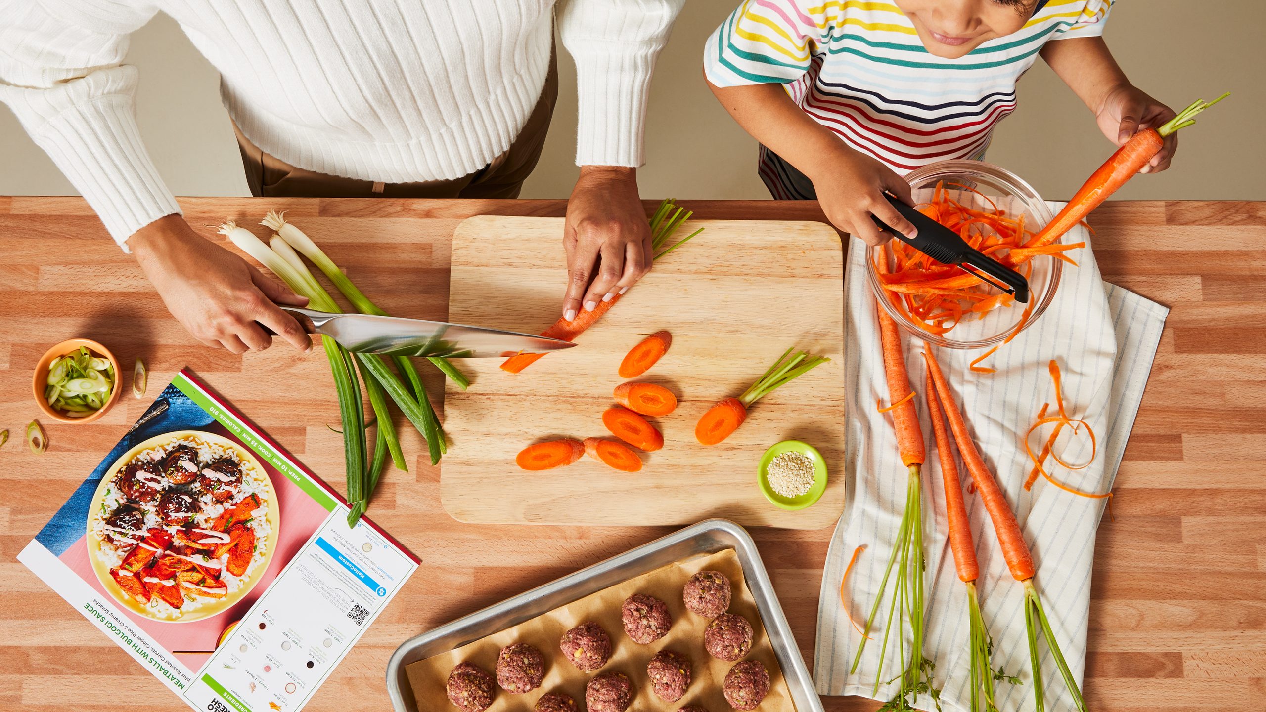 Mom and son cook HelloFresh homemade meal together