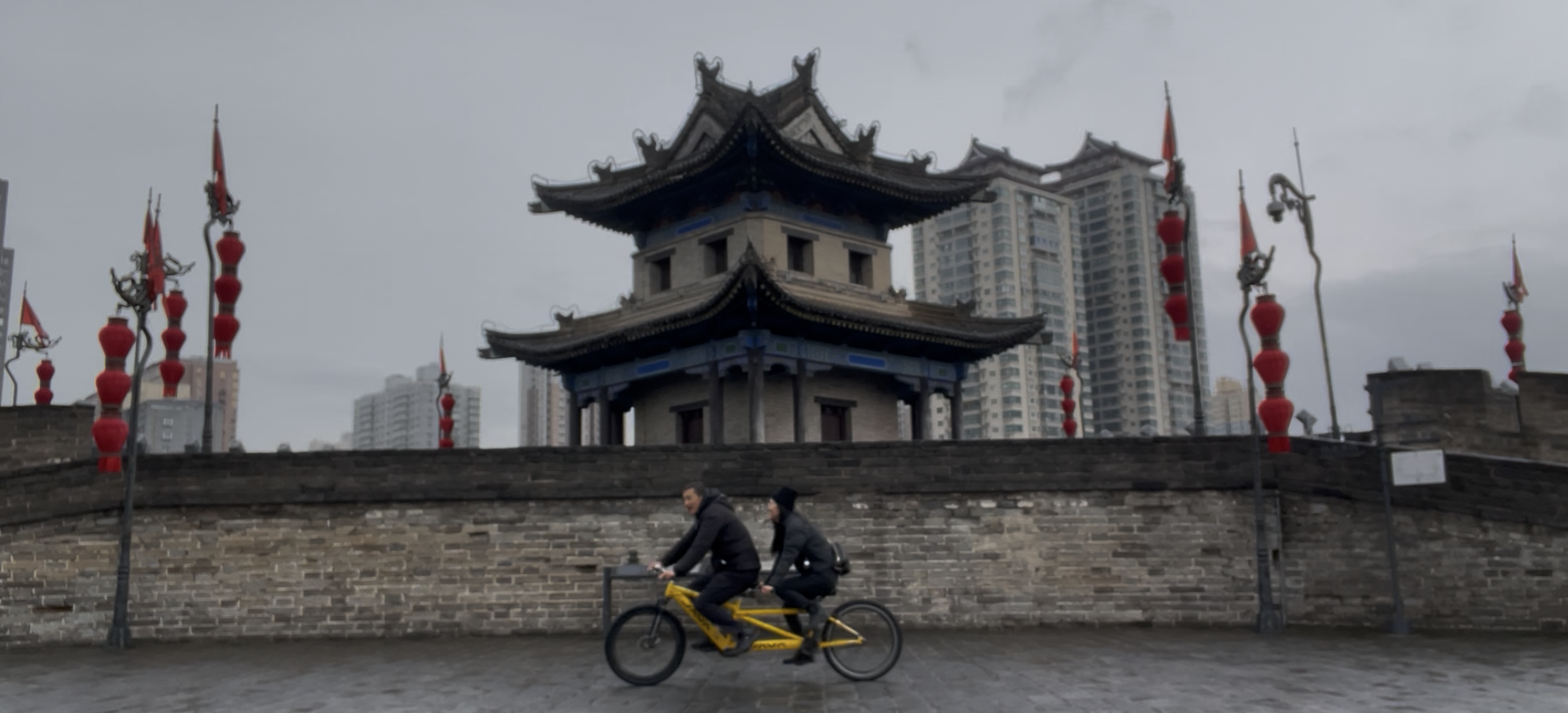 father and daughter bike the Xi'An City Walls