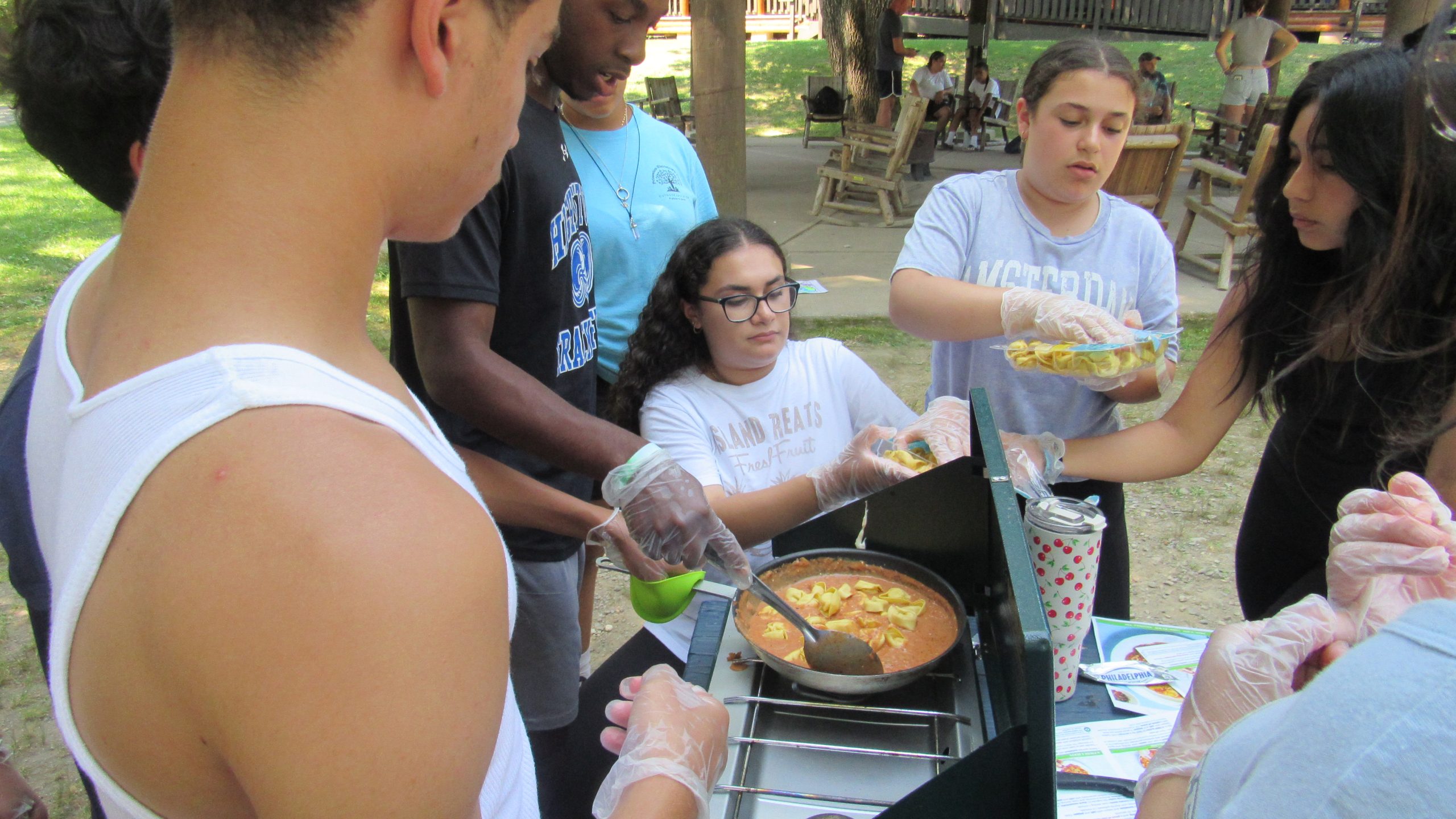 kids cook pasta at summer program