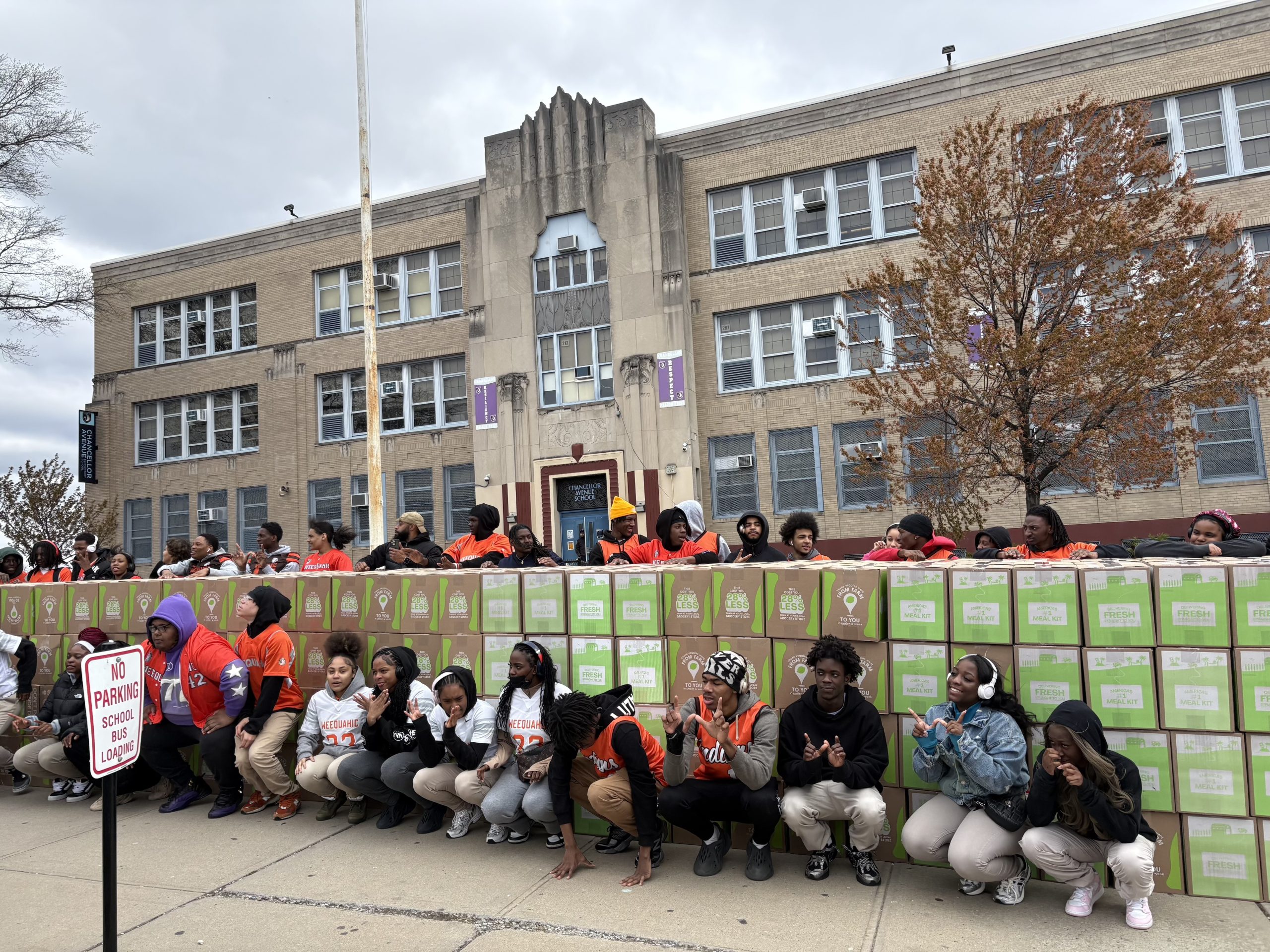 students outside of school with hellofresh boxes